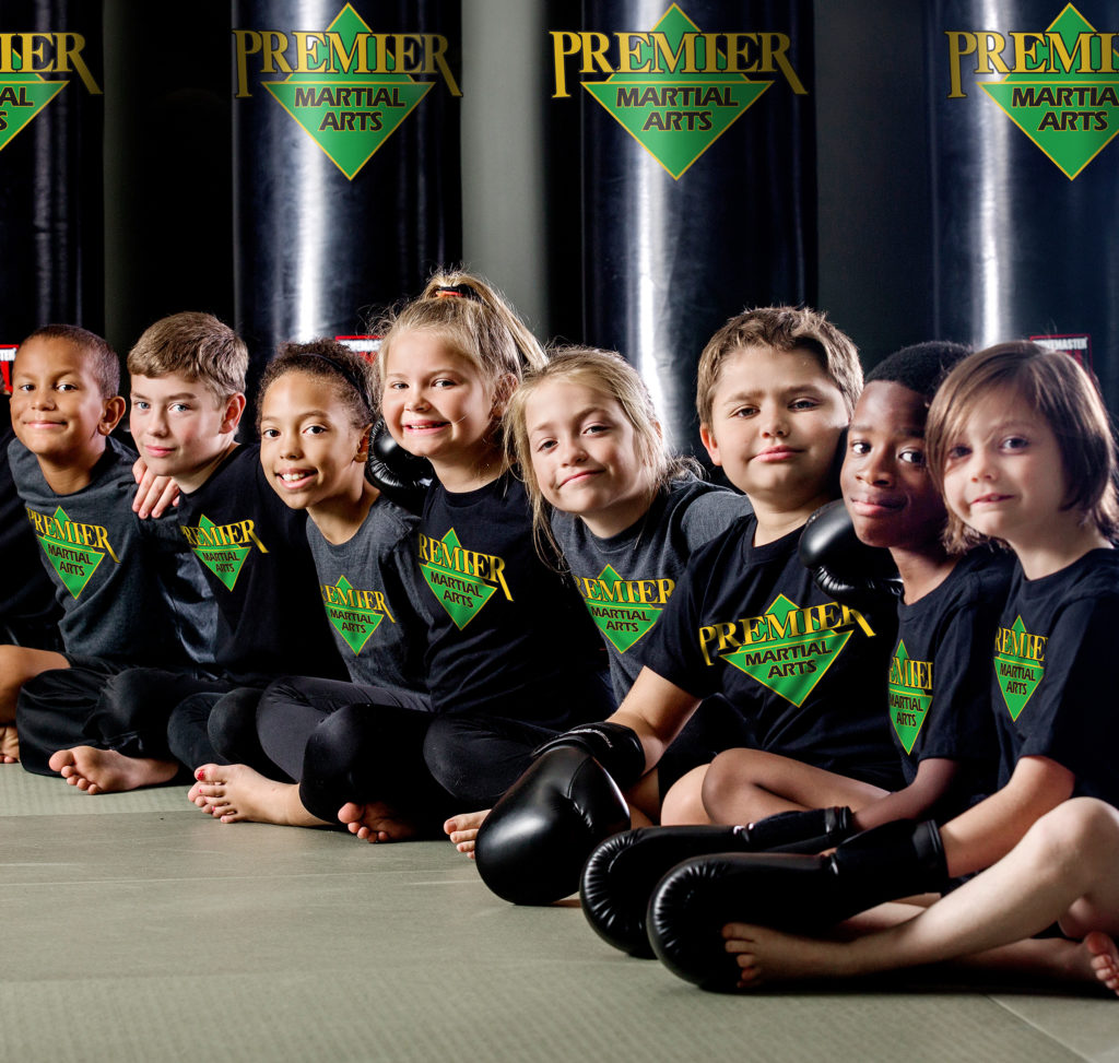 Children smiling after a juniors martial arts class in witham