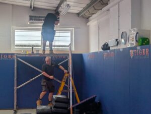workers installing efficient airconditioning in tiger martial arts bicester location