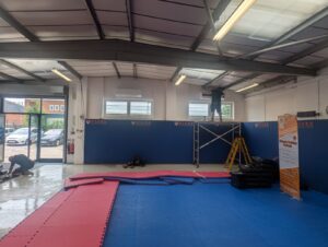 workers installing airconditioning in tiger martial arts bicester location